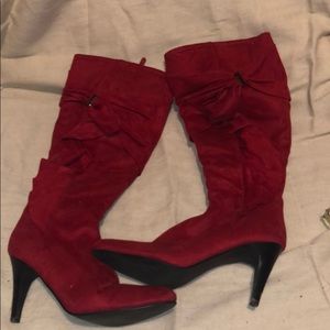 Zip up heeled red boots
